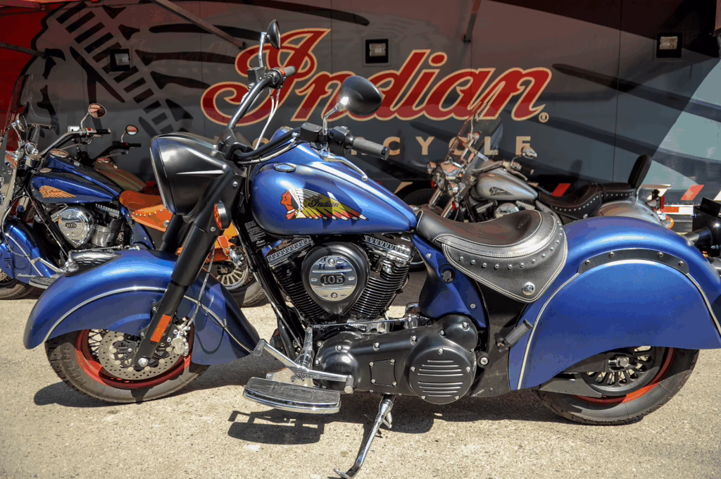 a blue Indian Motorcycle with the kickstand down