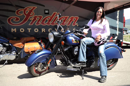 2010 Indian Chief 2 a woman sitting on a parked Indian Motorcycle