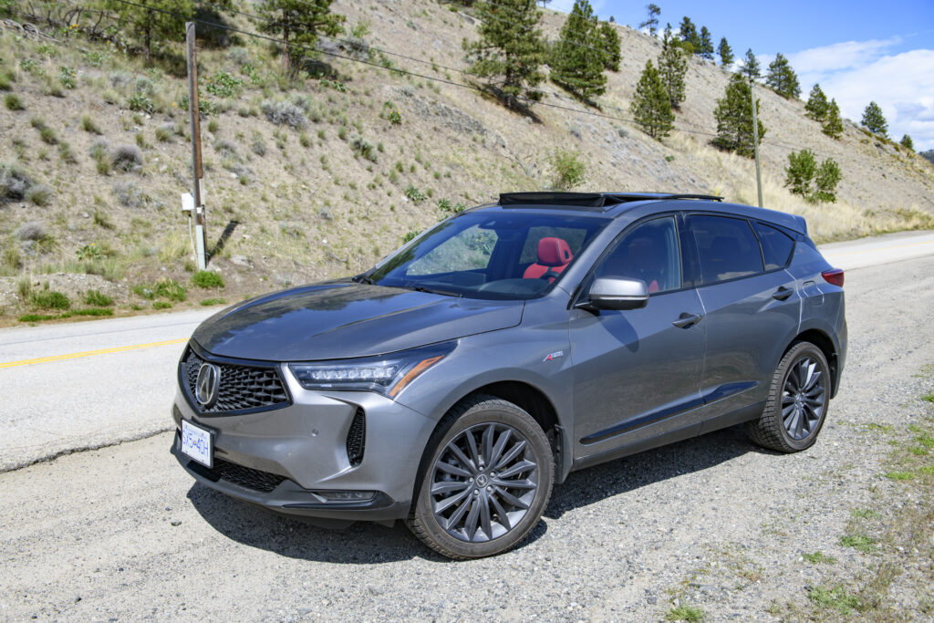 The 2023 Acura RDX A-Spec parked on the shoulder of the highway