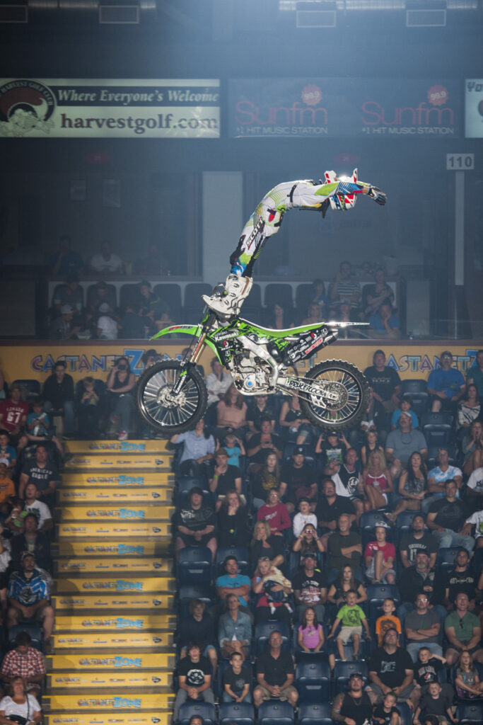 FMX champion, Bruce Cook, performs a trick called a cliffhanger