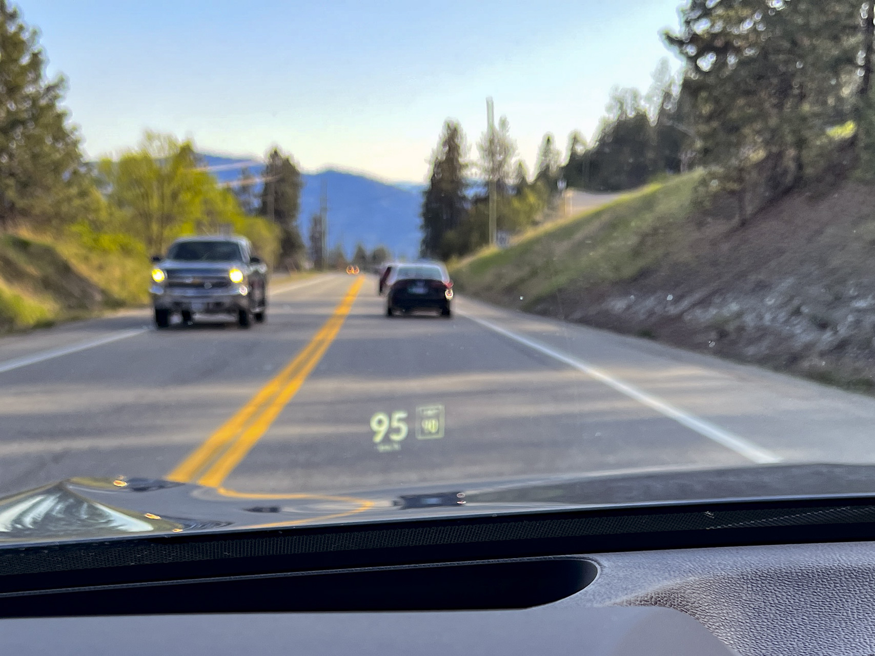 Speed and post signs appear in the windshield of the 2023 Acura RDX A-Spec SUV