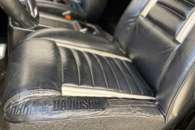 A Harley-Davidson leather jacket is repurposed into custom leather seat covers for a soft top Jeep.