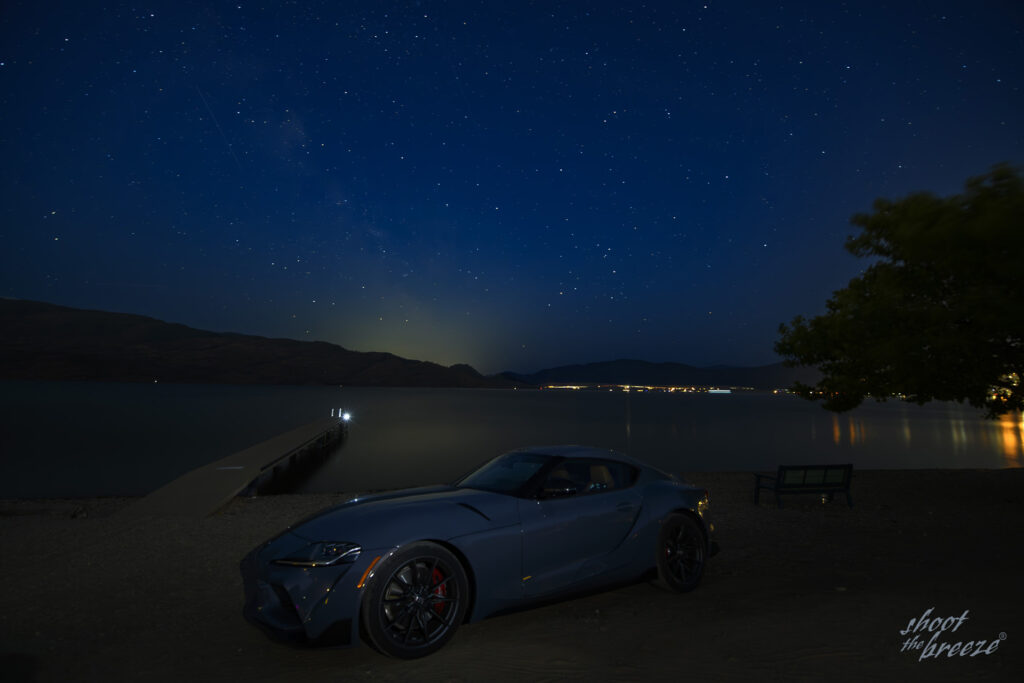 2023 Toyota GR Supra A91-MT parked at the beach beneath a starry sky