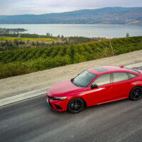 2023 Honda Civic SI parked on a hill above Okanagan Lake