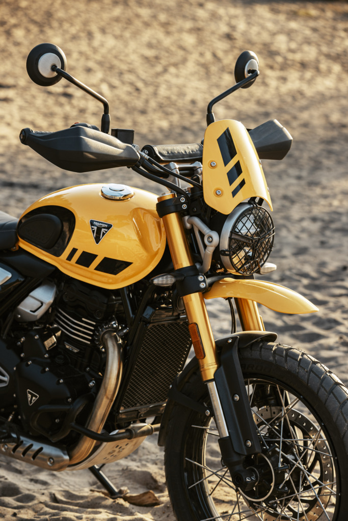Triumph Unveils the All New 2026 Scrambler 400 XC 7 a close up view of the gas tank and front of a motorcycle