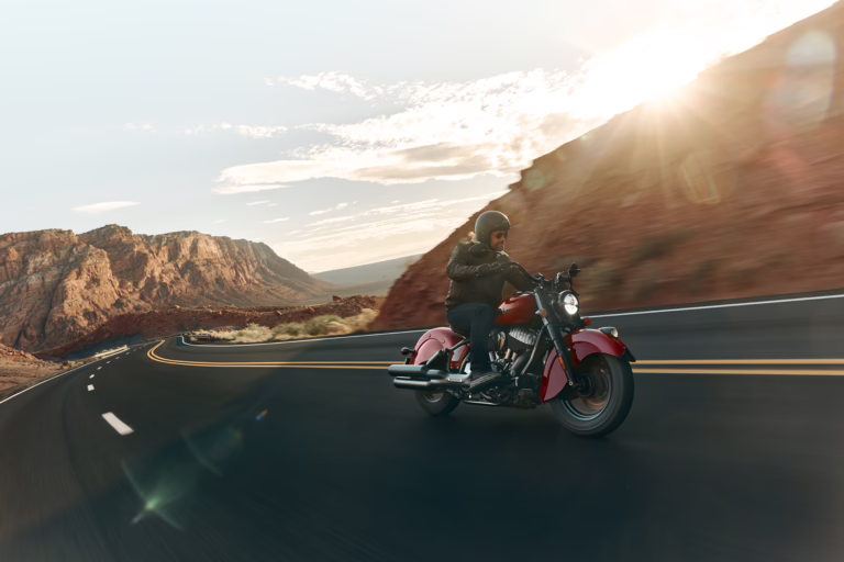A man rides a 2026 Indian Motorcycle Vintage Chief at sundown