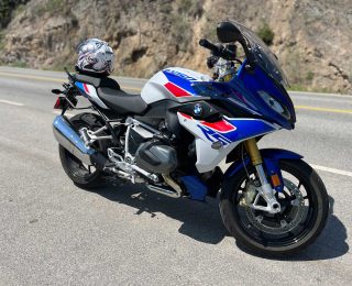 2023 BMS R1250 RS motorcycle in white, red and blue with a matching Arai helmet